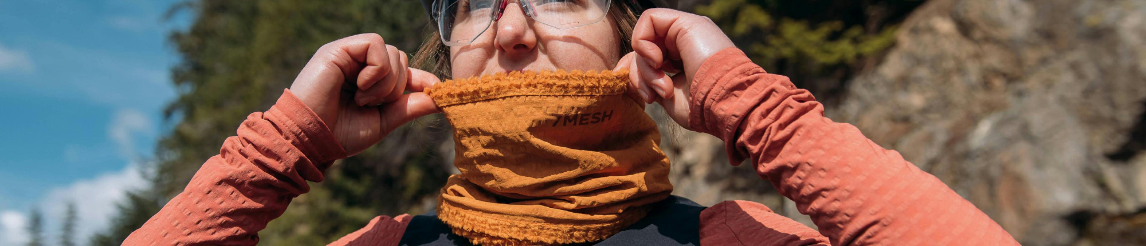 Woman wearing a neck warmer and thermal clothes