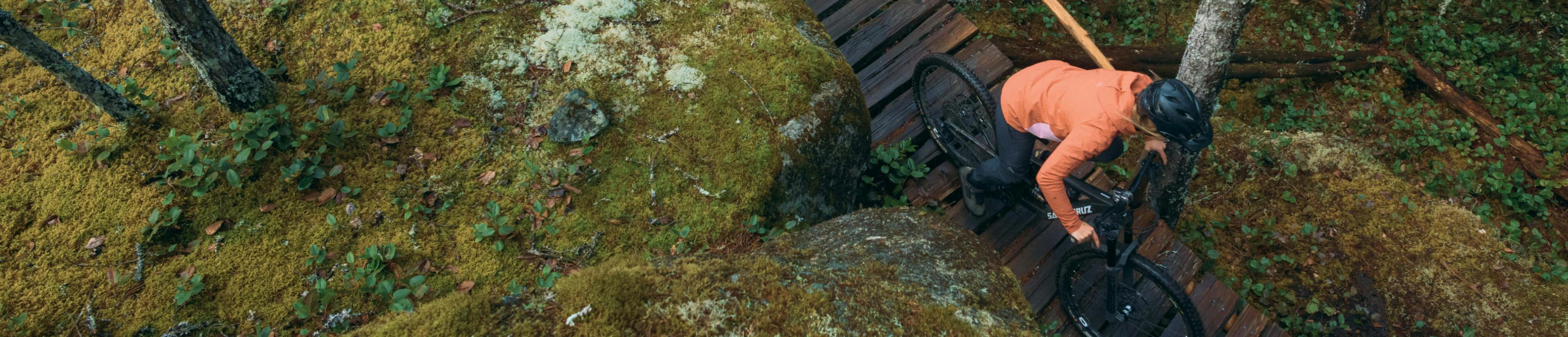 Woman riding a bike on the mountain